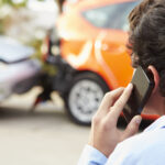 Teenage Driver Making Phone Call After Traffic Accident.